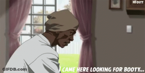 A Man In A Beanie Is Standing In Front Of A Window In A Living Room Looking For Booty . GIF
