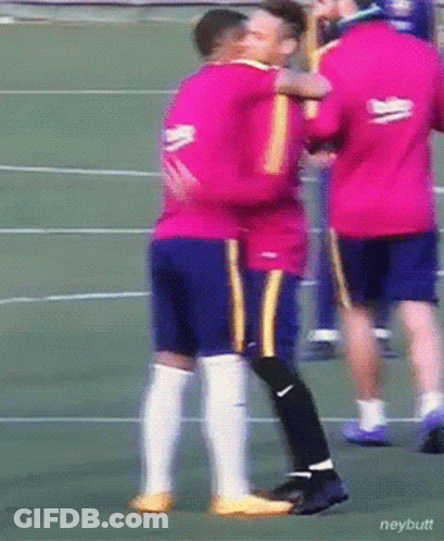 A Man In A Beko Jersey Hugging Another Man On A Soccer Field GIF