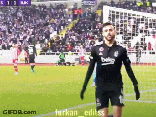 A Man In A Beko Jersey Is Standing On A Soccer Field GIF