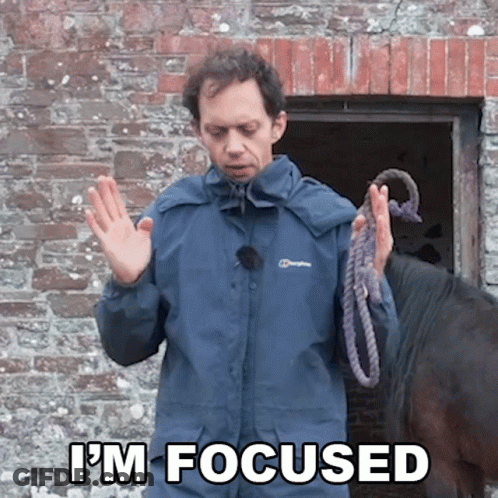 A Man In A Berghaus Jacket Holds A Rope In Front Of A Horse And Says " I 'M Focused " GIF