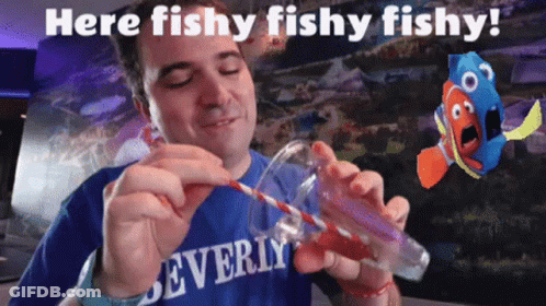 A Man In A Beverly Shirt Is Holding A Straw In A Glass GIF