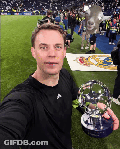 A Man In A Black Adidas Shirt Holds A Soccer Trophy GIF