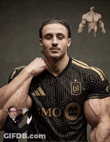 A Man In A Black And Gold Bmo Jersey Is Being Held By A Man In A Tuxedo GIF