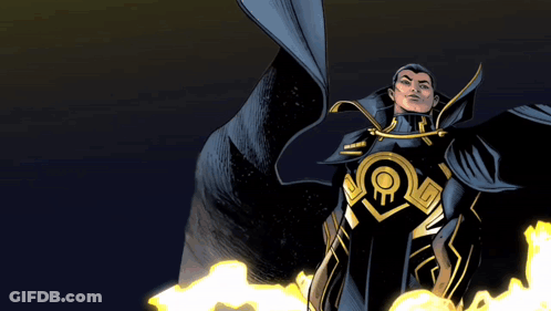 A Man In A Black And Gold Superhero Costume Stands In Front Of Flames GIF