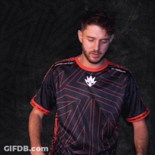 A Man In A Black And Red Shirt With A Leaf On The Front GIF