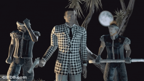 A Man In A Black And White Plaid Suit Stands Between Two Men GIF