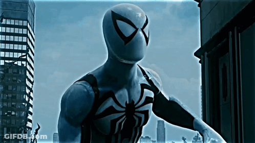 A Man In A Black And White Spiderman Costume GIF