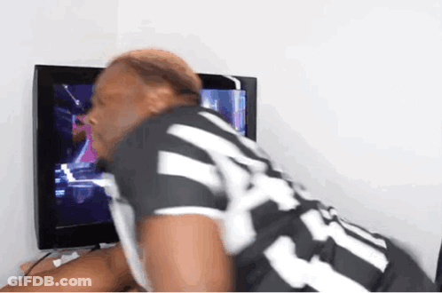 A Man In A Black And White Striped Shirt With The Number 24 On It GIF