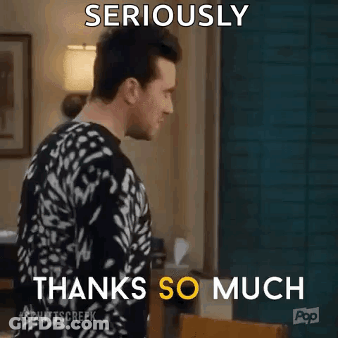 A Man In A Black And White Sweater Is Standing In A Living Room And Says `` Seriously Thanks So Much '' . GIF
