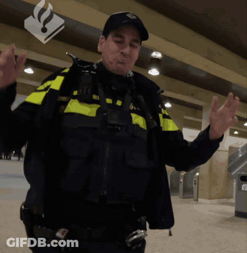 A Man In A Black And Yellow Uniform With The Letter N On His Hat GIF