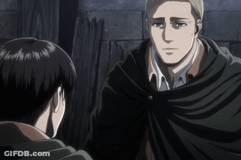 A Man In A Black Cape Stands Next To Another Man GIF