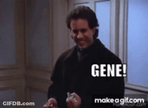 A Man In A Black Coat Is Holding A Key And Says Gene GIF