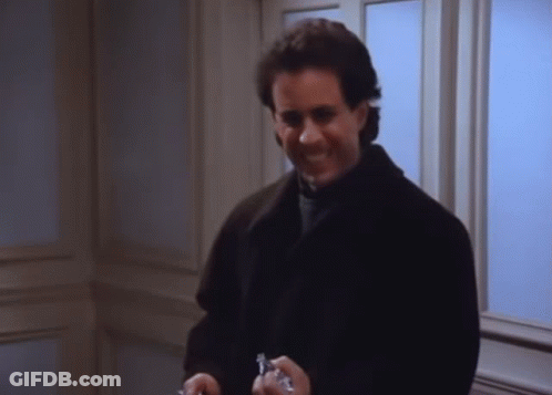 A Man In A Black Coat Is Holding A Pair Of Keys In His Hands GIF