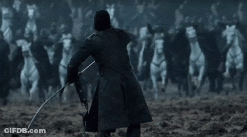 A Man In A Black Coat Is Holding A Sword In Front Of A Crowd Of White Horses . GIF
