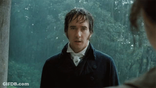 A Man In A Black Coat Stands In The Rain Looking At Another Man GIF