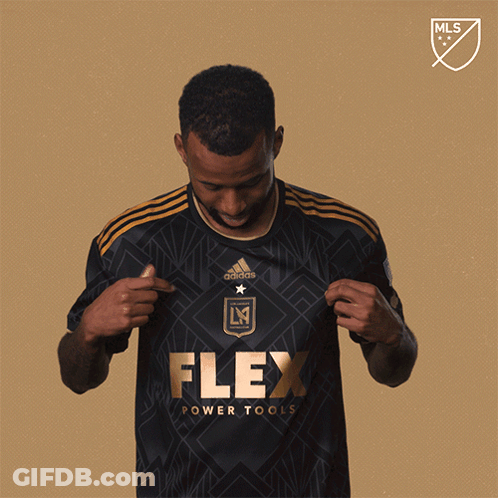 A Man In A Black Flex Power Tools Jersey GIF