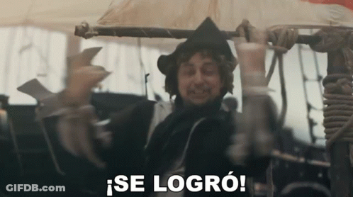 A Man In A Black Hat Is Holding A Pole And Says Se Logro GIF