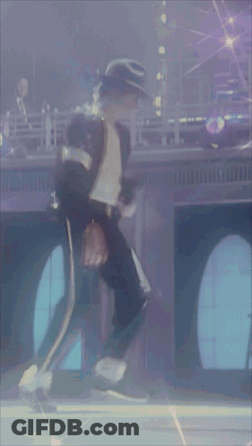 A Man In A Black Hat Is Standing In Front Of A Window GIF