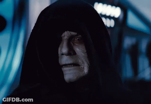 A Man In A Black Hood With A White Face And Teeth GIF