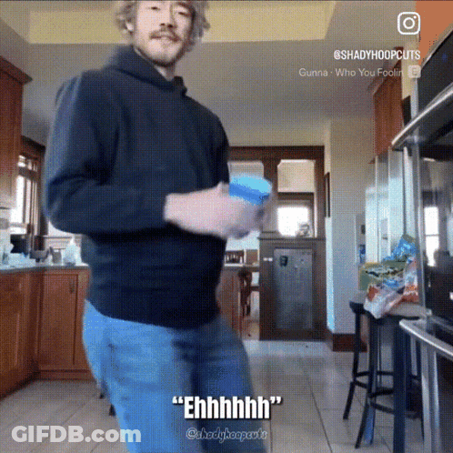 A Man In A Black Hoodie Is Dancing In A Kitchen With The Caption " Ehhhh " GIF