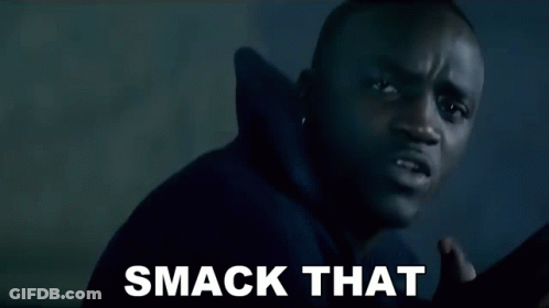 A Man In A Black Hoodie Is Making A Funny Face And The Words Smack That Are On The Screen Behind Him . GIF