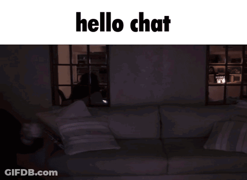 A Man In A Black Hoodie Is Pointing At Something With The Words Hello Chat Written Above Him GIF