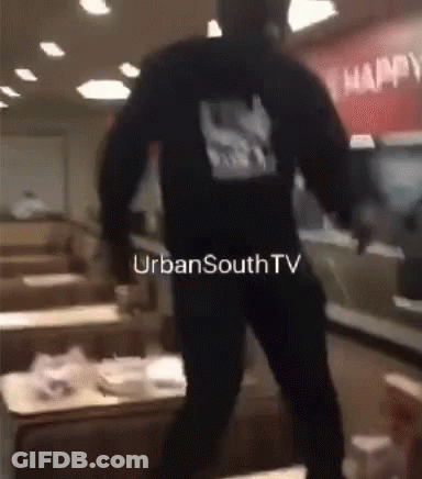 A Man In A Black Hoodie Is Standing In A Restaurant With Urbansouthtv Written On The Bottom Of The Image GIF
