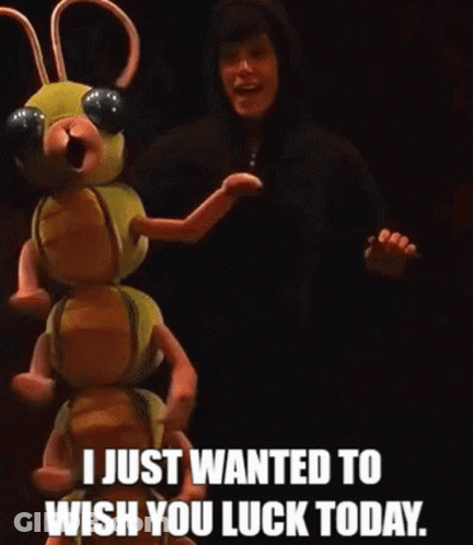 A Man In A Black Hoodie Is Standing Next To A Stuffed Animal That Says I Just Wanted To Wish You Luck Today . GIF