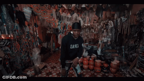 A Man In A Black Hoodie With The Letter B On The Front GIF