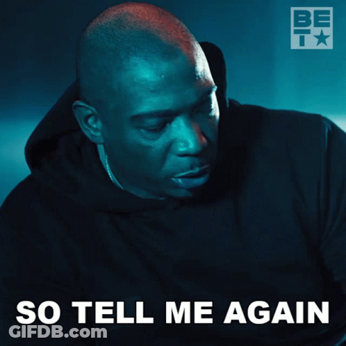 A Man In A Black Hoodie With The Words So Tell Me Again Written Below Him GIF