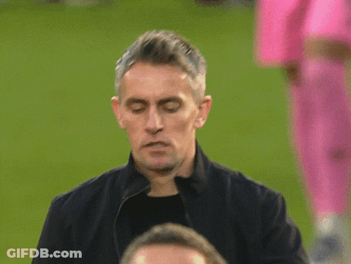 A Man In A Black Jacket Has A Button On His Jacket That Says ' United ' GIF