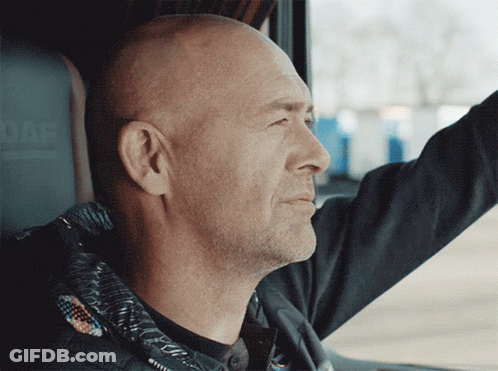 A Man In A Black Jacket Is Driving A Daf Vehicle GIF