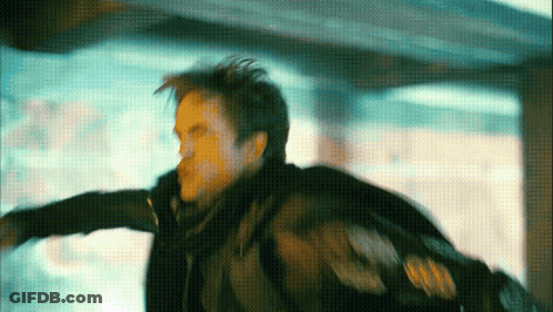 A Man In A Black Jacket Is Flying Through The Air In A Blurry Photo GIF
