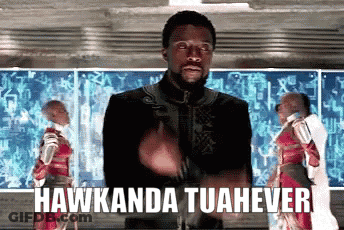 A Man In A Black Jacket Is Giving A Thumbs Up With The Words Hawkanda Tuahever Behind Him . GIF
