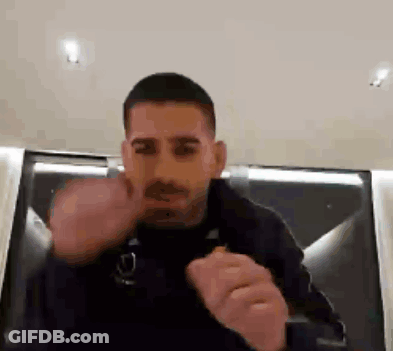 A Man In A Black Jacket Is Giving The Middle Finger GIF