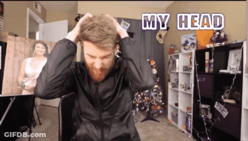 A Man In A Black Jacket Is Holding His Hair With The Words My Head Above Him GIF