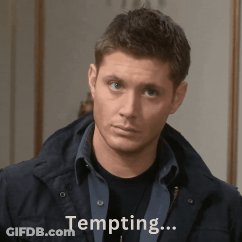 A Man In A Black Jacket Is Looking At The Camera With The Words Tempting Behind Him GIF