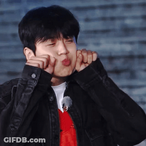 A Man In A Black Jacket Is Making A Funny Face With His Hands GIF