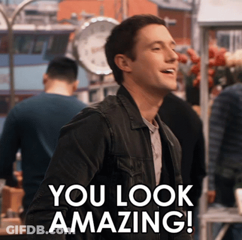 A Man In A Black Jacket Is Smiling And Says " You Look Amazing " GIF