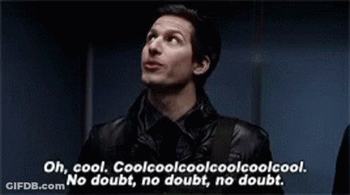 A Man In A Black Jacket Is Standing In Front Of A Blue Wall And Talking . GIF