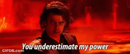 A Man In A Black Jacket Is Standing In Front Of A Red Background And Says `` You Underestimate My Power '' . GIF