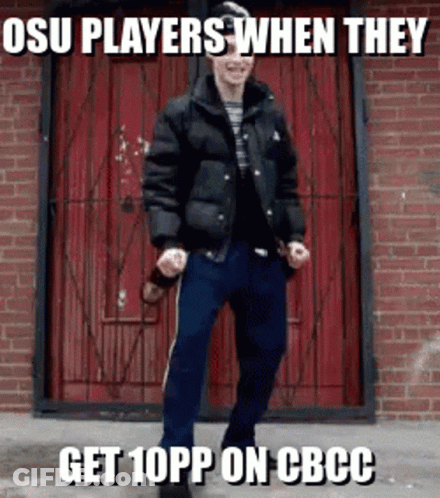 A Man In A Black Jacket Is Standing In Front Of A Red Door With The Caption Osu Players When They Get 10Pp GIF