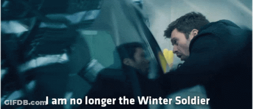 A Man In A Black Jacket Is Standing Next To A Car With The Words I Am No Longer The Winter Soldier Above Him GIF