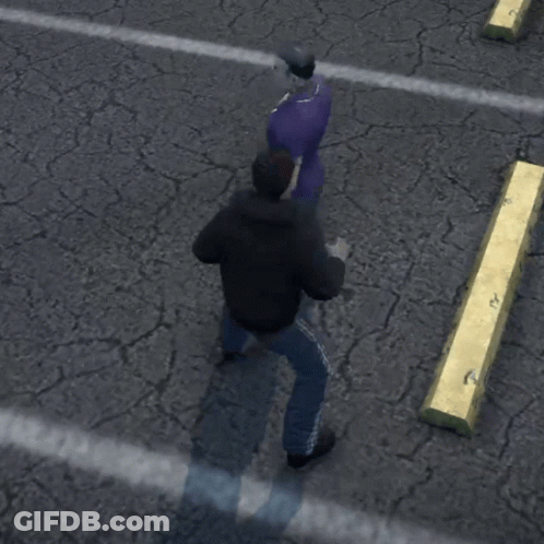 A Man In A Black Jacket Is Standing Next To A Man In A Purple Shirt Who Is Laying On The Ground GIF