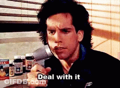 A Man In A Black Jacket Says " Deal With It " In Front Of A Shelf Full Of Vitamins GIF