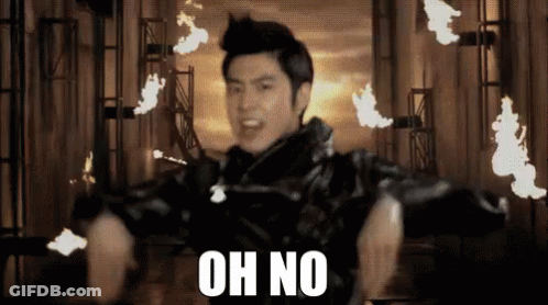 A Man In A Black Jacket Says Oh No In Front Of Fire GIF