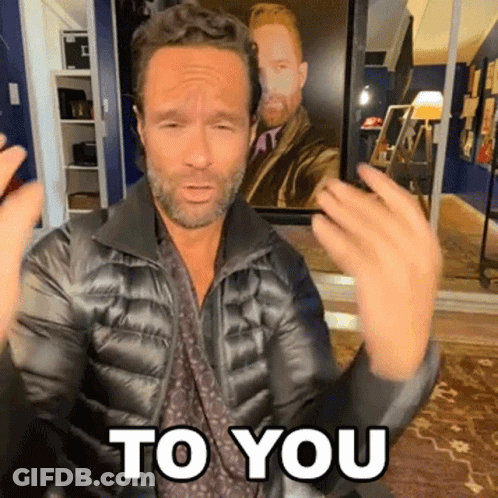 A Man In A Black Jacket Says " To You " GIF