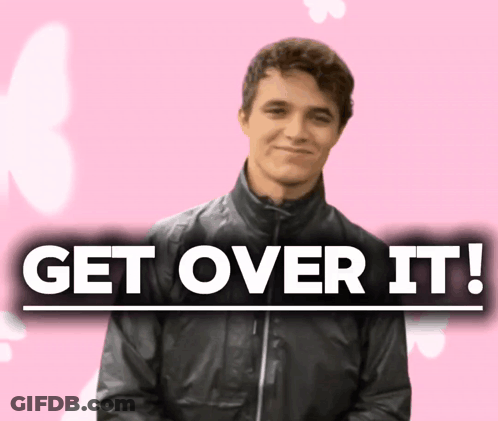 A Man In A Black Jacket Stands In Front Of A Sign That Says " Get Over It " GIF