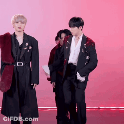 A Man In A Black Jacket With A Red Fur Collar GIF