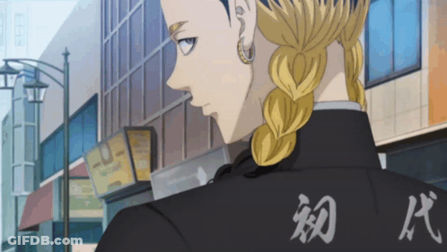 A Man In A Black Jacket With Chinese Writing On It GIF